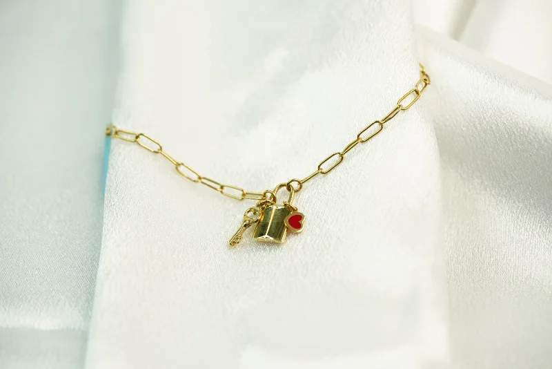 Ladies Dangling Charm Bracelets -18k Key, Padlock and Heart Clip Bracelet