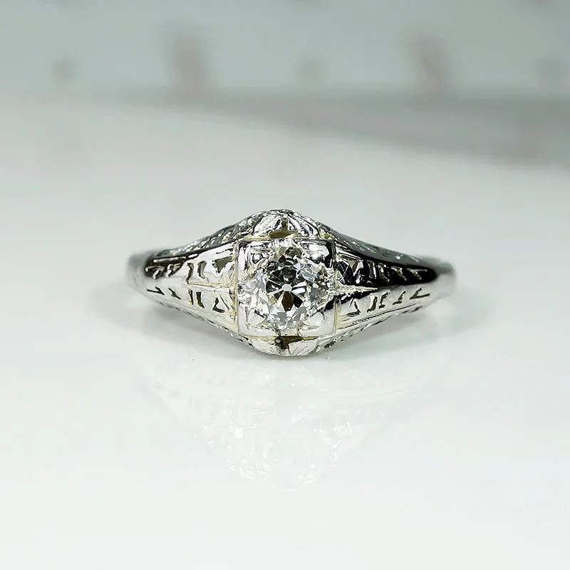 Ladies Shell Rings -Ornate White Gold Solitaire Ring with Charming Old Diamond